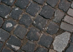 Detailed view of cobblestone pavement showing texture and arrangement.